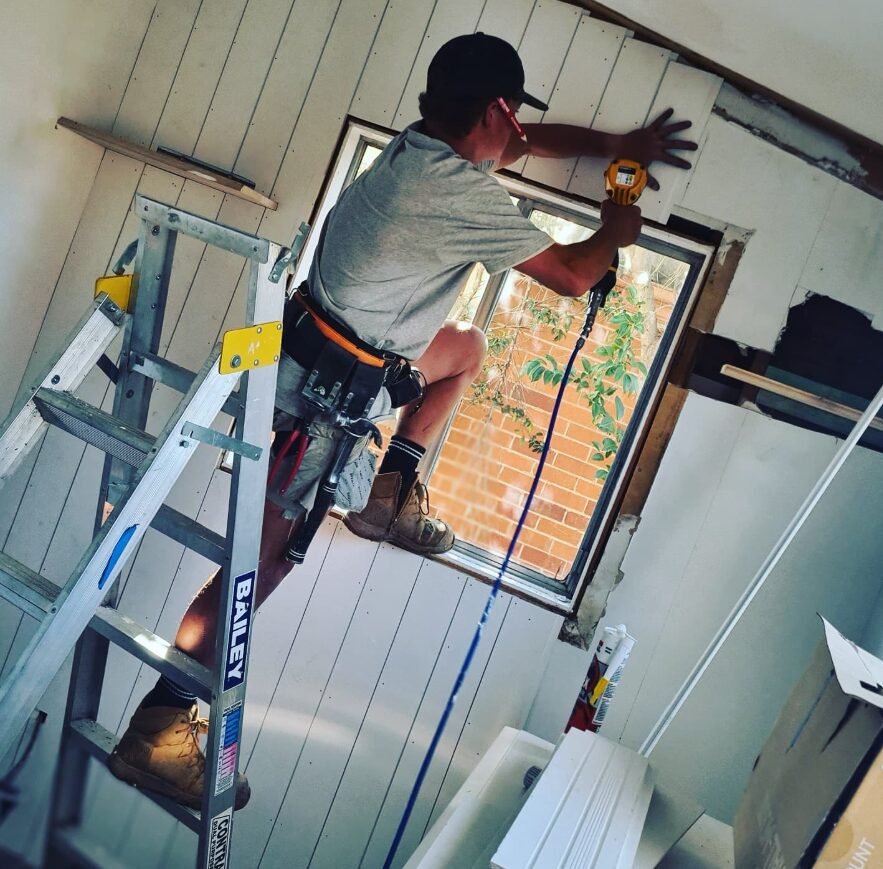 Jack Power Constructions carpenter setting a new window opening